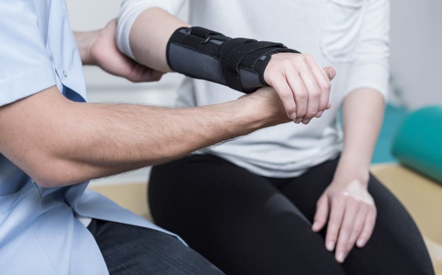 stock-photo-woman-using-wrist-immobiliser-after-hand-s-injury-300602654